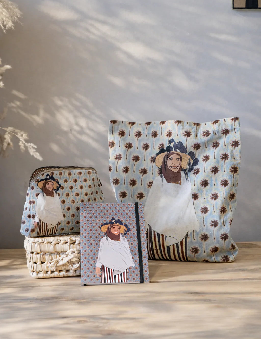 Ethnik Moroccan tote bag, pouch, and notebook with smiling woman illustration on patterned fabric