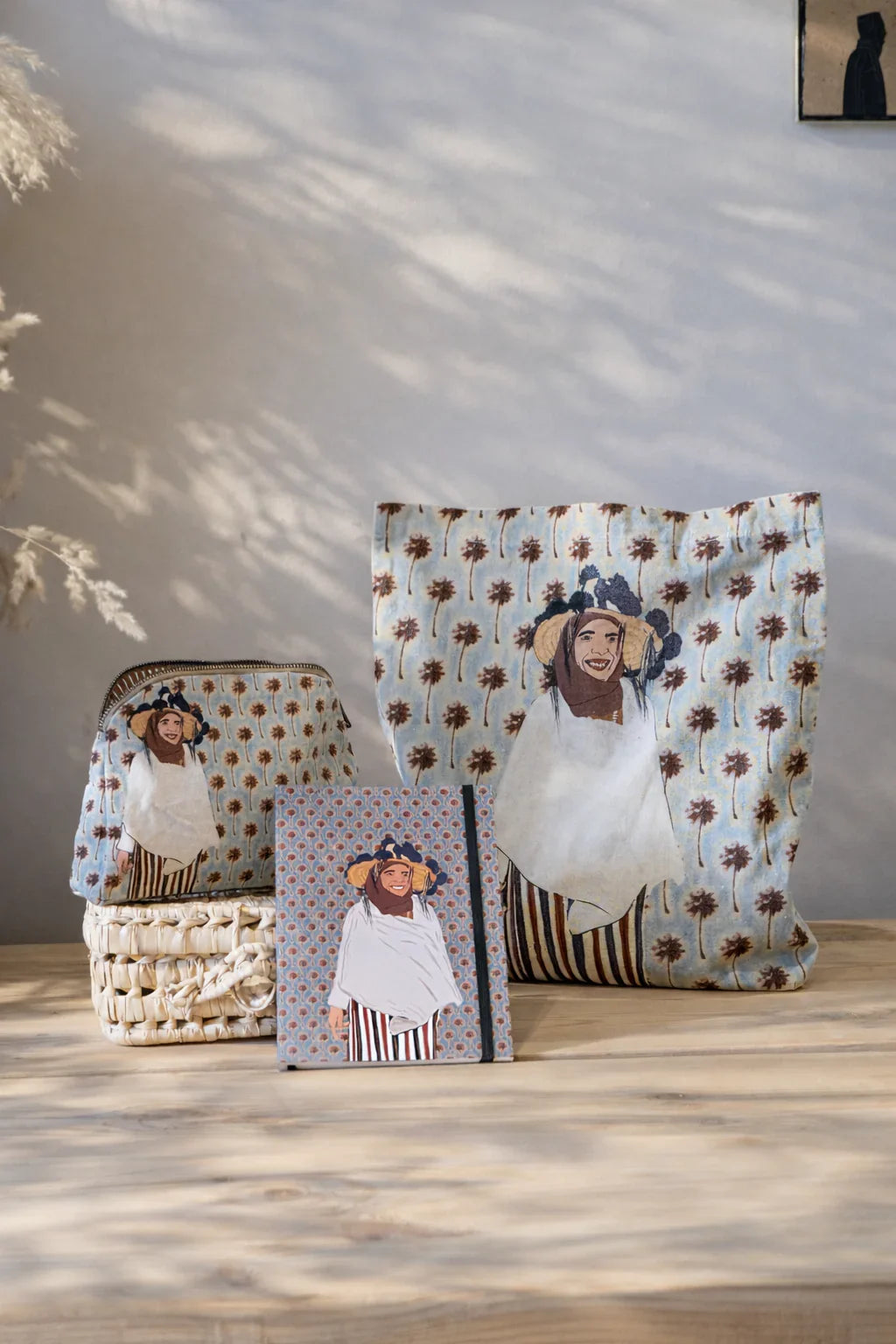 Ethnik Moroccan tote bag, pouch, and notebook with smiling woman illustration on patterned fabric