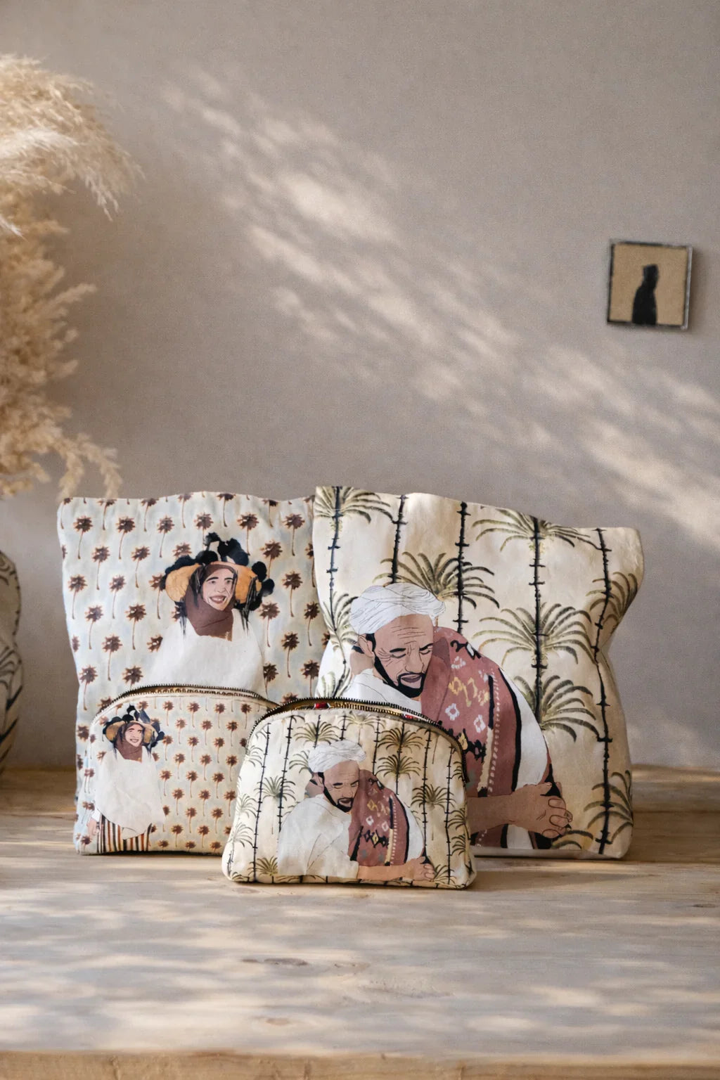 Ethnik Moroccan accessories pouches with original illustrated designs on a wooden surface