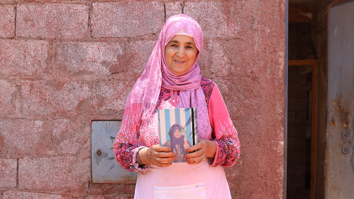 Moroccan Portrait Photography of a woman holding a personalised notebook- made in Morocco