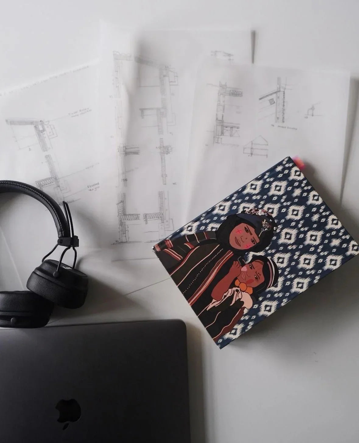 Ethnik Moroccan patterned notebook with illustration, laptop, headphones, and architectural sketches
