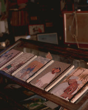 Ethnik stationery notebooks with original Moroccan illustrations displayed on a glass counter