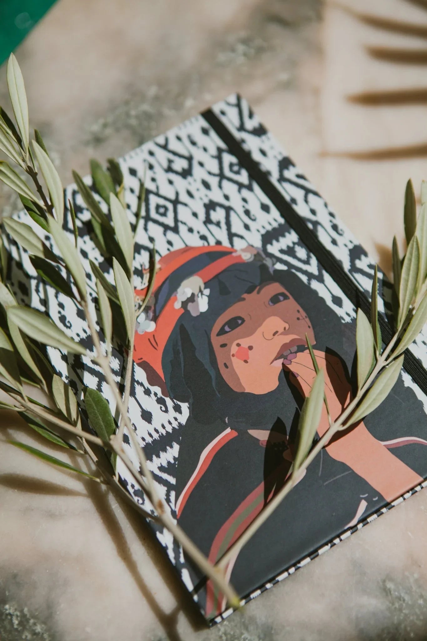 ethnik Moroccan illustrated notebook on patterned cover with olive branches