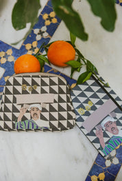 ethnik Morocco pouch and notebook with geometric design, oranges, and tiled background