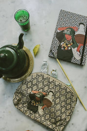 Ethnik Moroccan illustrated notebook and pouch with tea set and art supplies on marble table