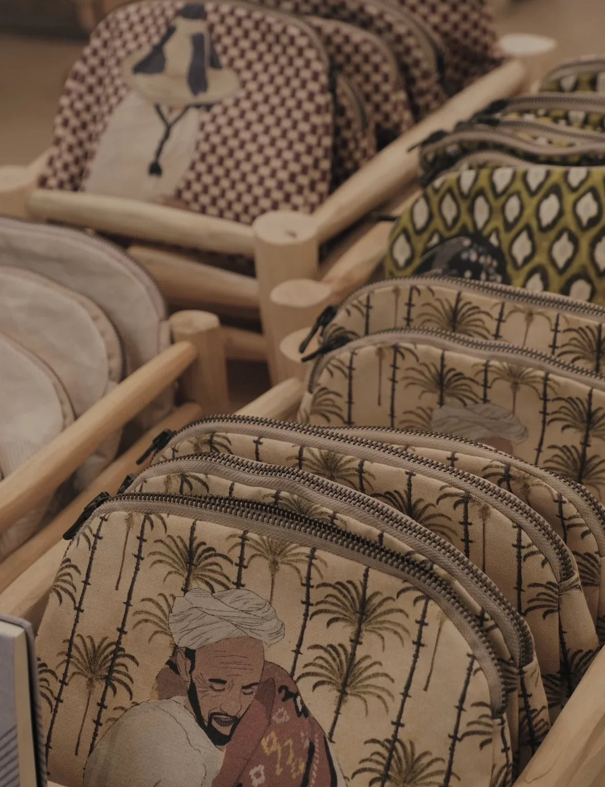 Ethnik Moroccan pouches with original illustrated designs displayed in wooden trays