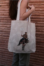 Ethnik tote bag with Moroccan illustration of man on donkey holding 'TAXI' sign, outdoor setting