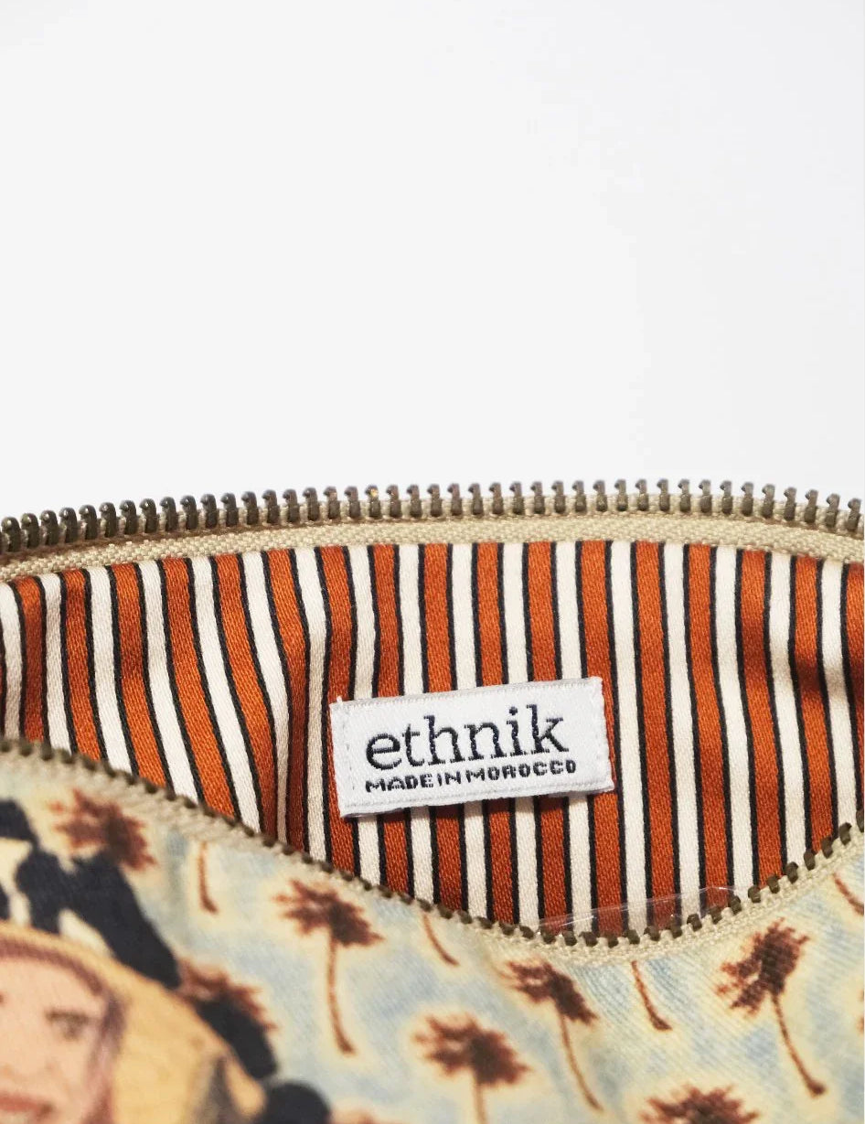 ethnik pouch with striped orange lining and 'Made in Morocco' label, palm tree pattern