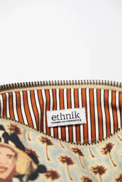 ethnik pouch with striped orange lining and 'Made in Morocco' label, palm tree pattern
