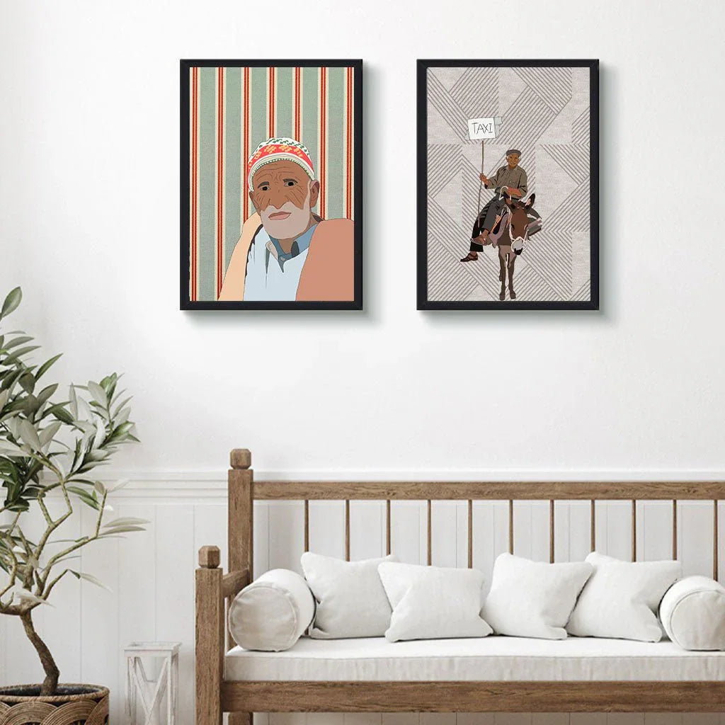 Moroccan illustration wall art in black frames above a white bench with pillows, ethnik decor
