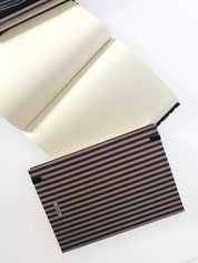 Ethnik Morocco striped notebook with dotted pages, stationery and accessories on white background